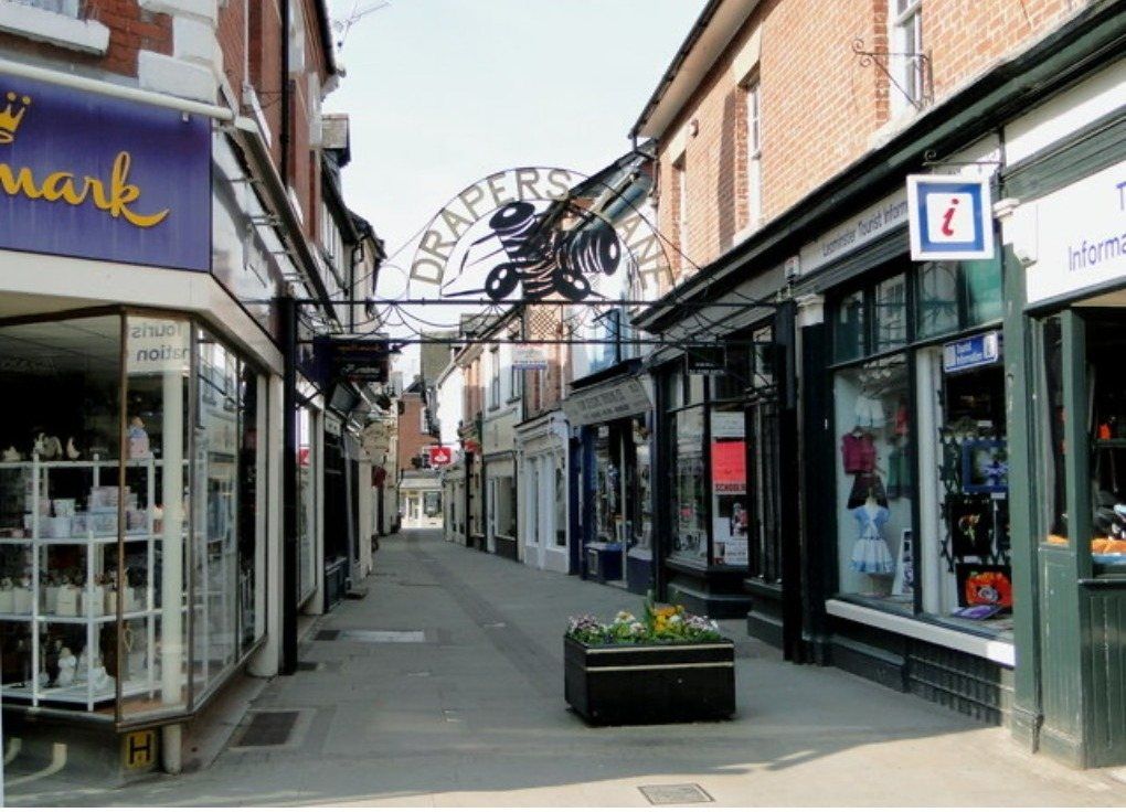 Drapers Lane after the works, with new paving and entrance arch
