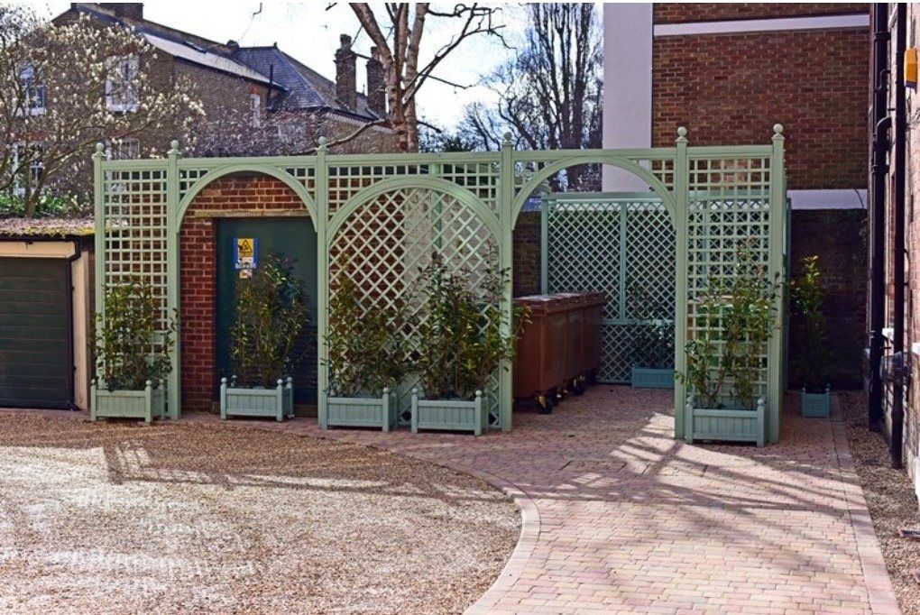 Timber trellis screen and planters around the Elms Court bin store