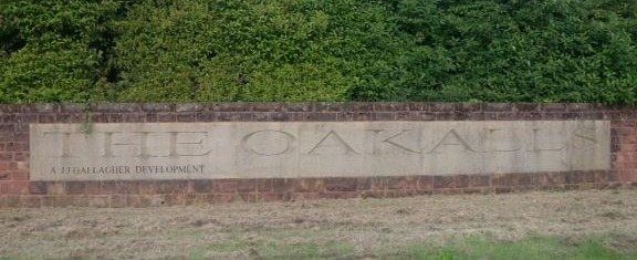 Stone entrance sign wall at The Oakalls